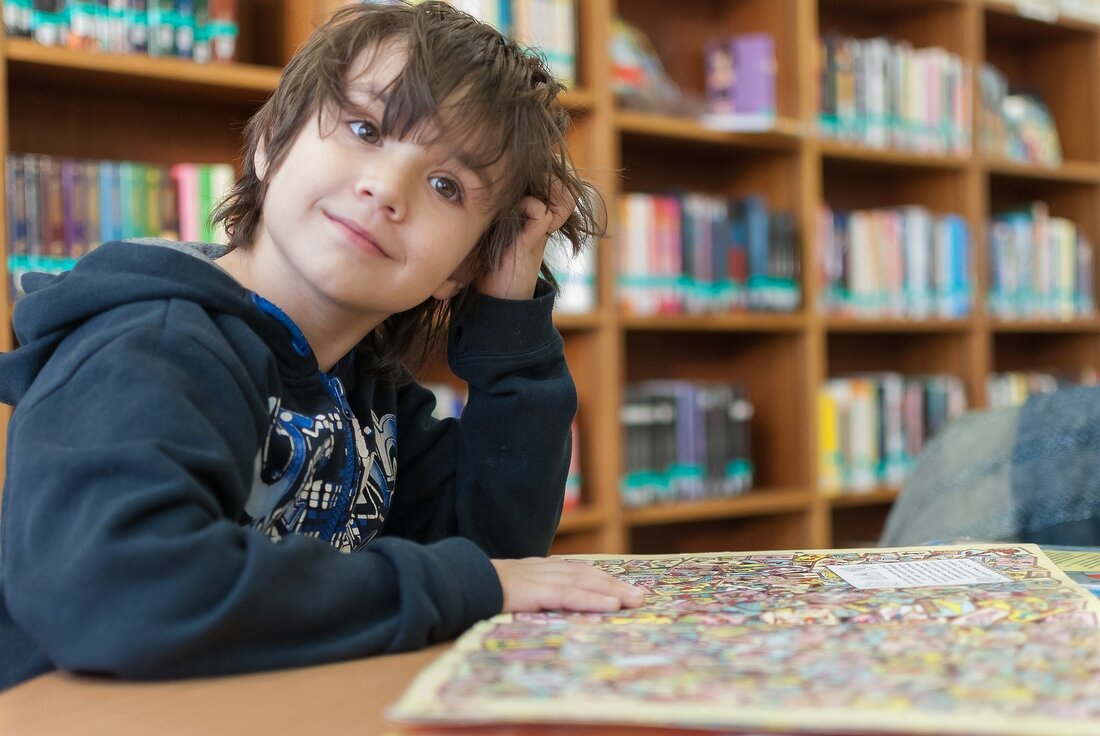 Kid scratching his head at a puzzle